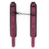 Розово-черные наручники на застежках - 1